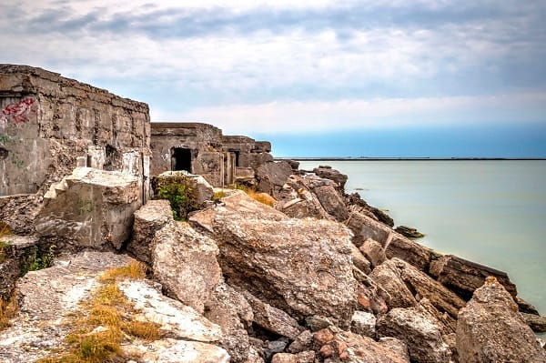 55998301 - view on ruined building on liepaja beach against of endless waterscape, latvia
